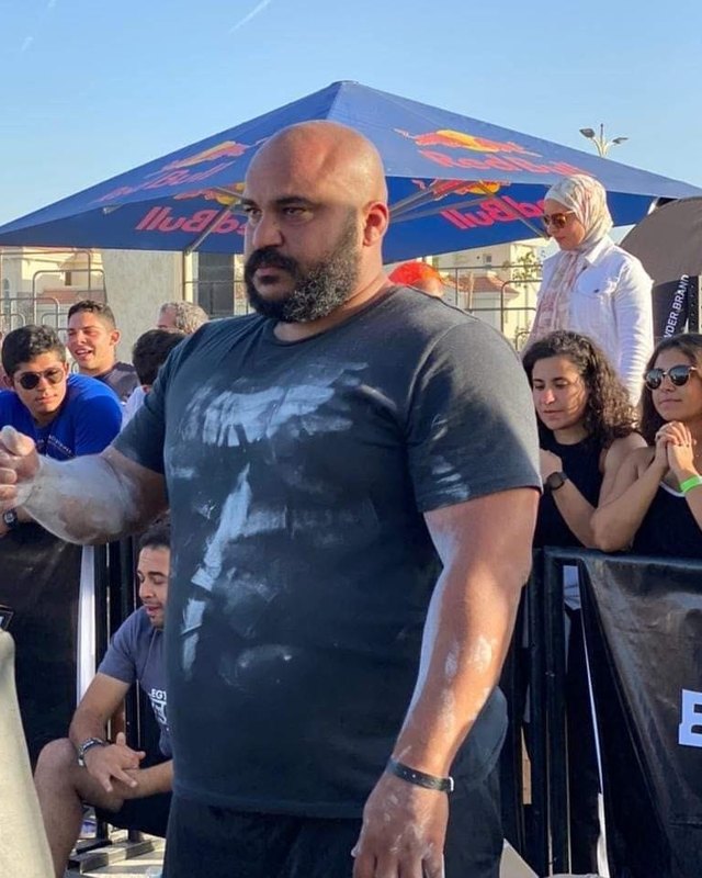 Ahmad chalked up at a strongman competition